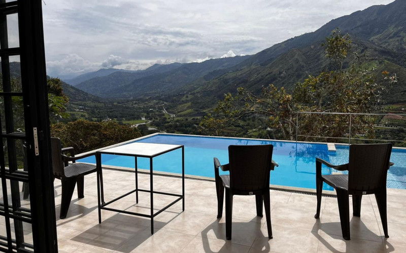 High-yield luxury villa near Medellin: 6 BR, pool, and incredibly low $23 USD annual taxes.