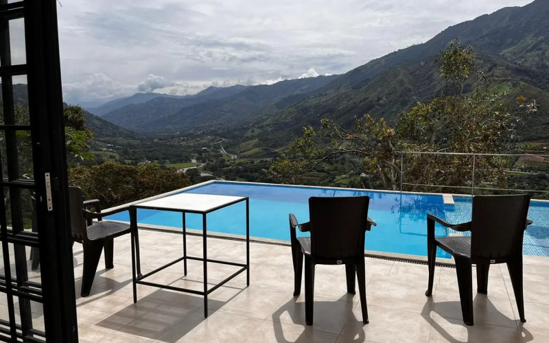 High-yield luxury villa near Medellin: 6 BR, pool, and incredibly low $23 USD annual taxes.