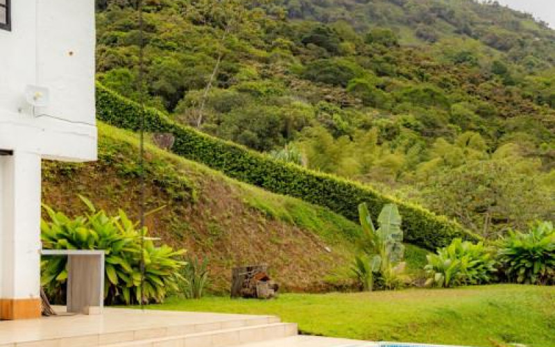 High-yield luxury villa near Medellin: 6 BR, pool, and incredibly low $23 USD annual taxes.